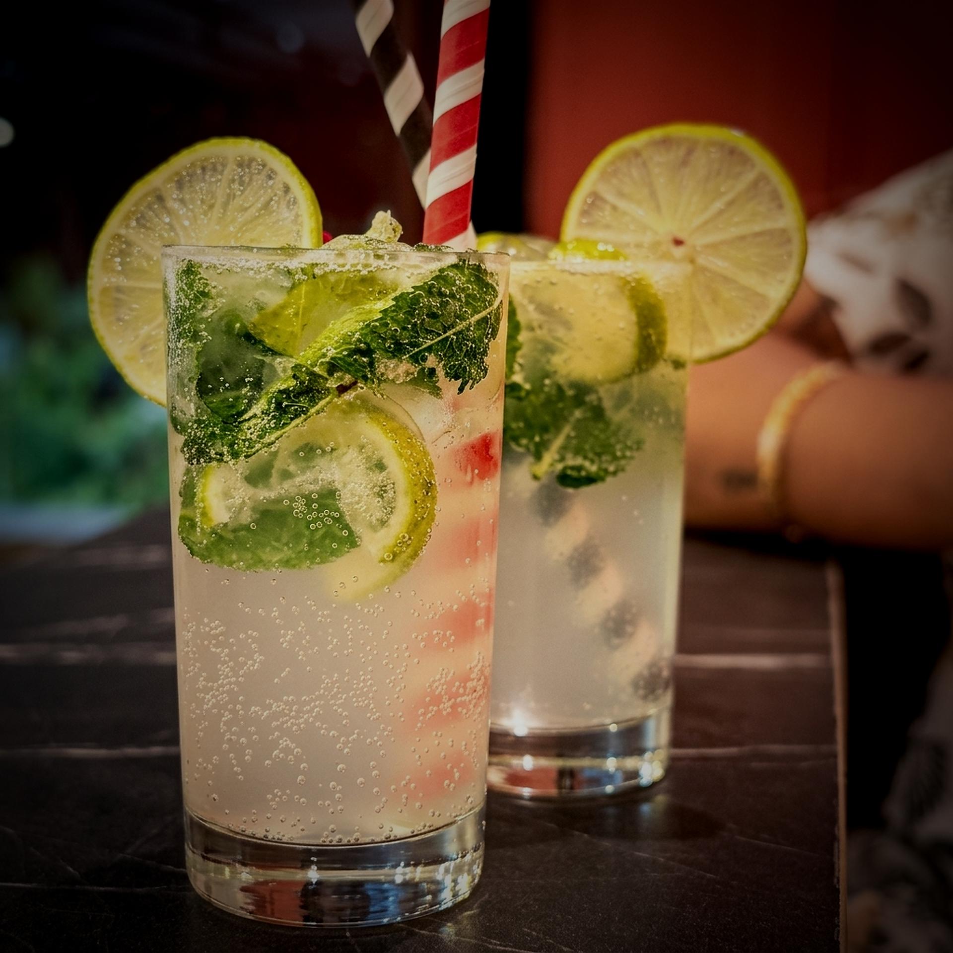 Refreshing lemonade mocktails with lime slices