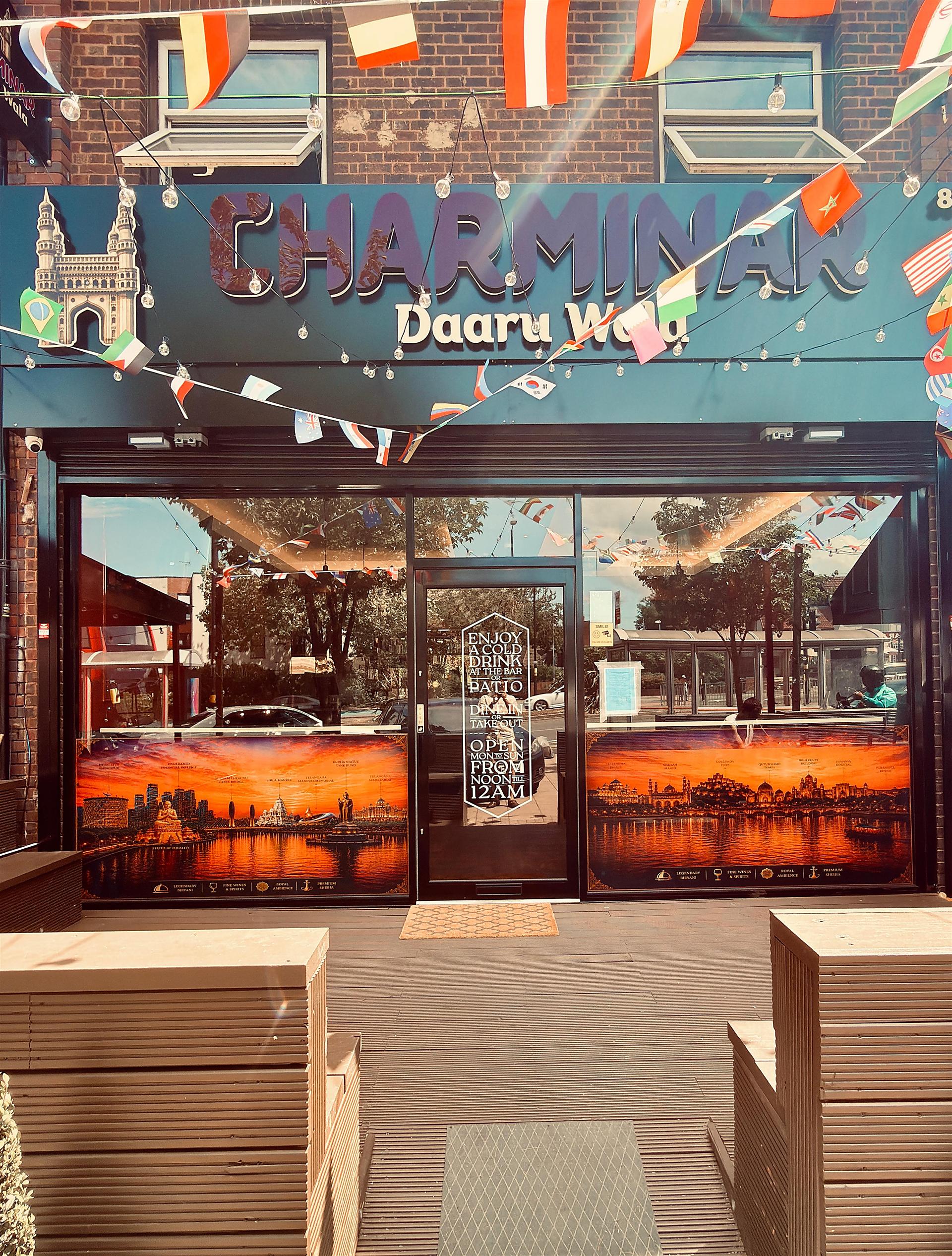 Bright and clean daytime storefront facade of Charminar Daaru Wala