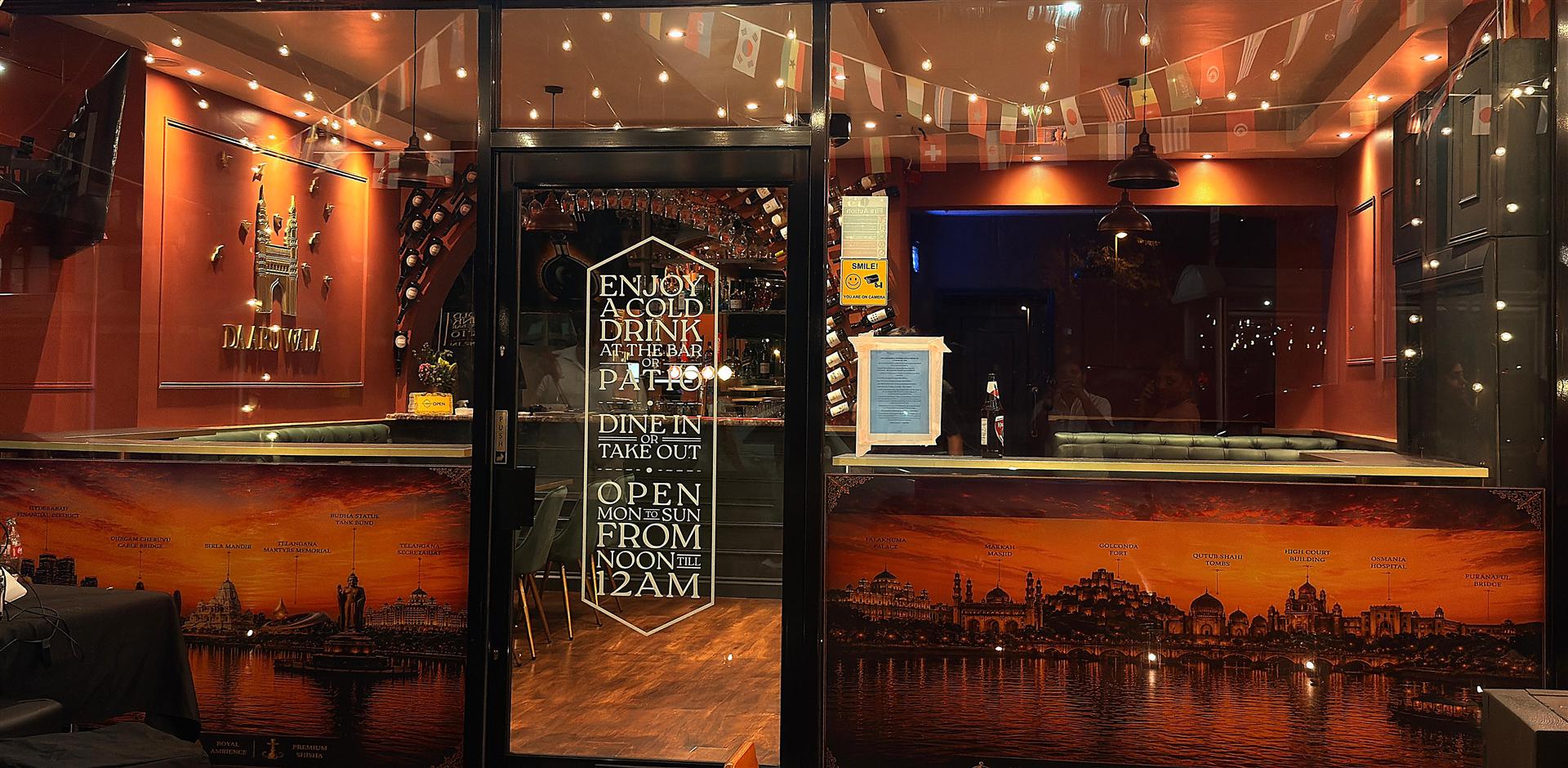 Intimate dining experience visible through our storefront window at night